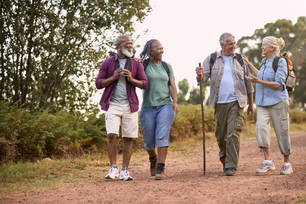 A group of active older adults enjoying hiking together.